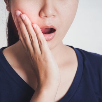toothache jaw pain asian woman