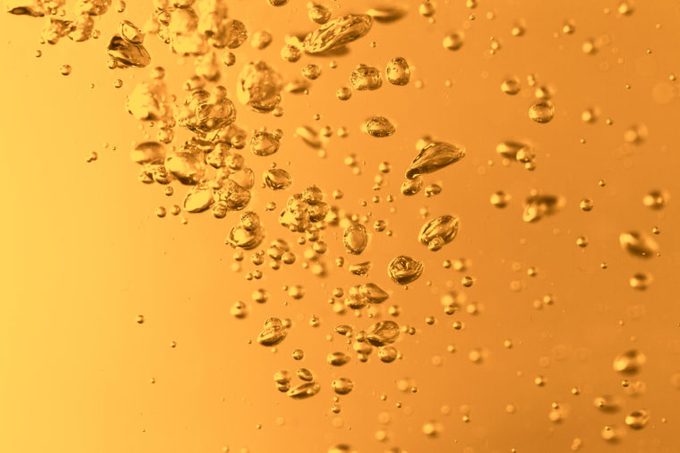 closeup of yellow carbonated water