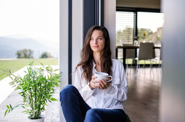 woman relaxed and happy sitting at home
