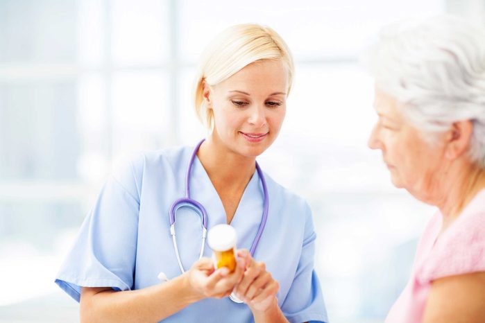 female healthcare working explaining prescription to patient