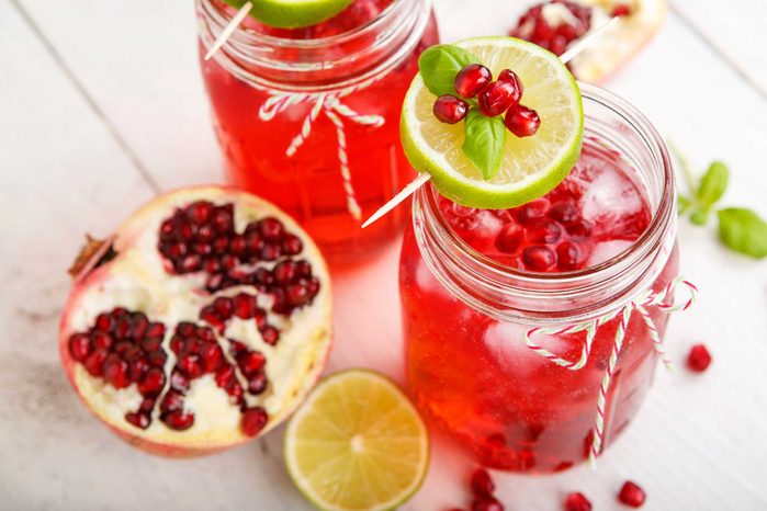 Mason jars with pomegranate and lime drinks
