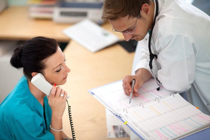 nurse and doctor discussing schedule