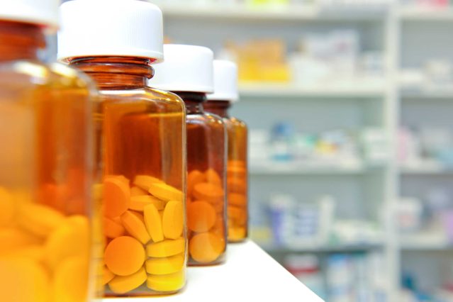 bottles of pills in a pharmacy