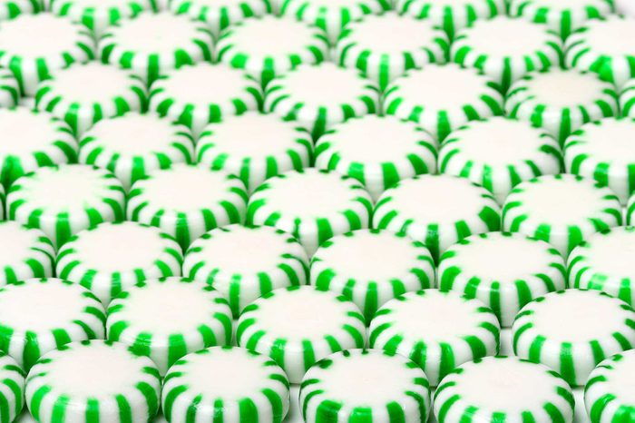 Green candy breath mints in rows.