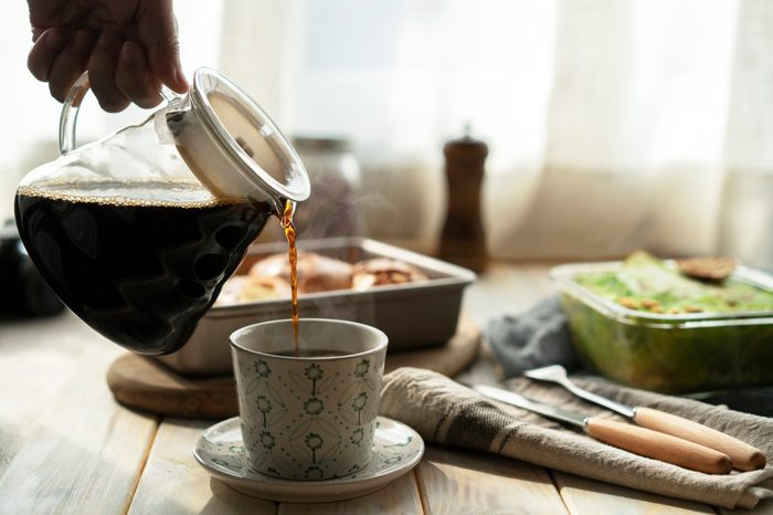 coffee pot pouring into cup