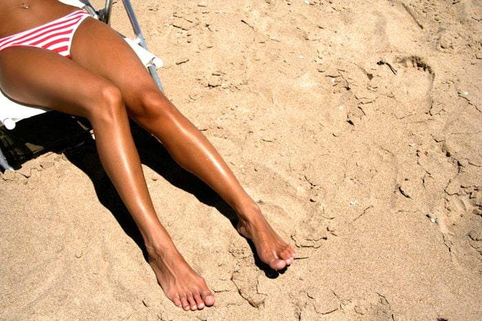 Woman's tanning on the beach.