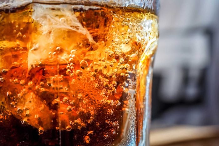 closeup of a glass of cola and ice