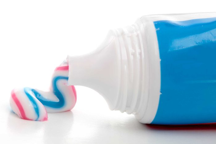 Toothpaste squirting from a tube.
