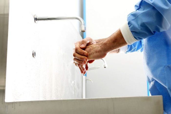 healthcare worker washes hands
