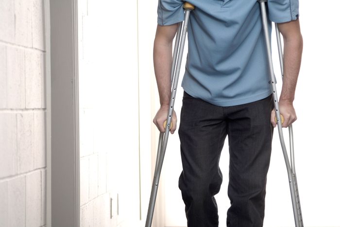 person wallking on crutches