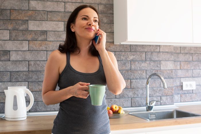 woman talking on the phone in kitchen