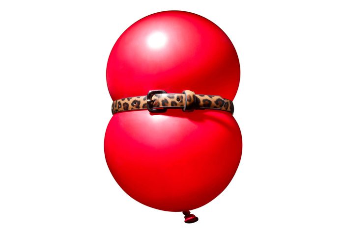 red ballon with a cinched leopard-print belt around the center