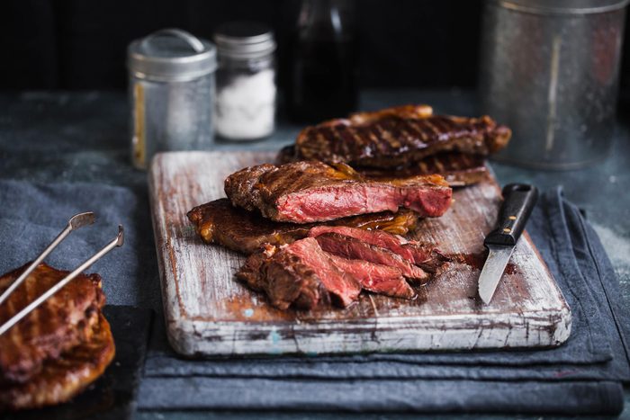Grilled steak on a cutting board.