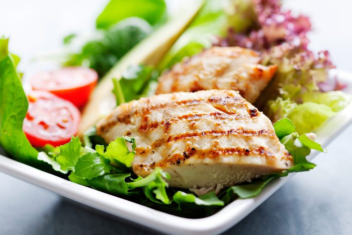 Grilled chicken on a salad.