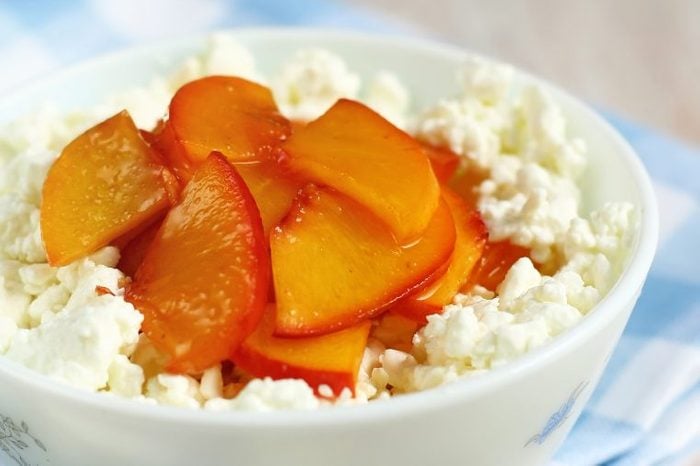 Cottage cheese topped with nectarine slices.