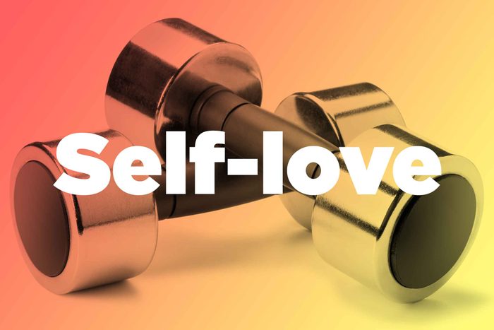 Words "self-love" over hand weights