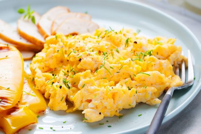 Plate of soft scrambled eggs.