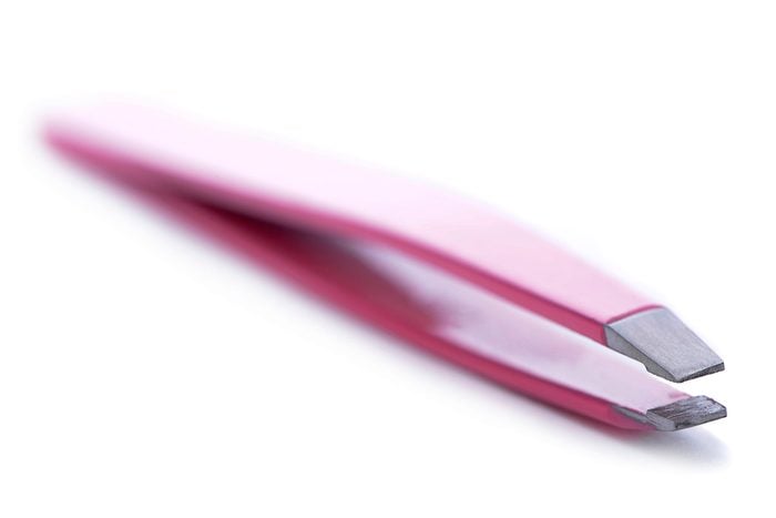 close up of a pair of pink tweezers