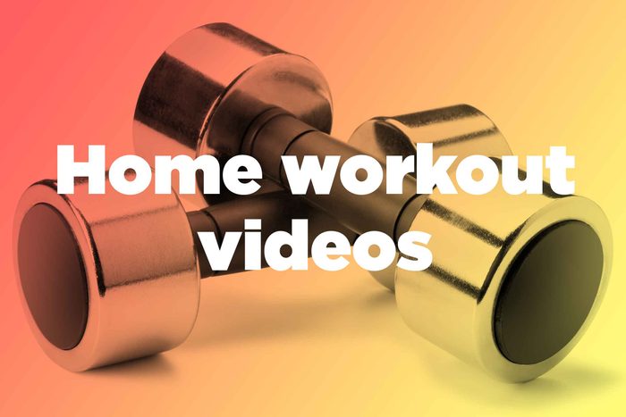 Words "home workout videos" over hand weights