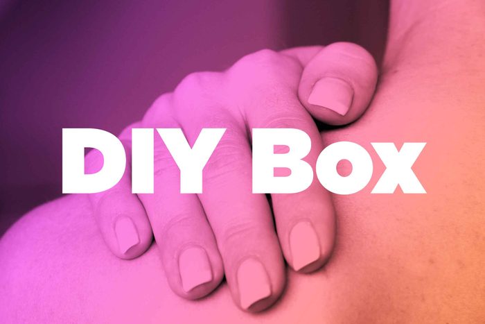 Words "DIY Box" over image of hands rubbing shoulder