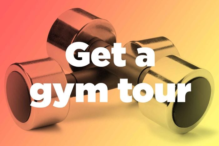Words "get a gym tour" over hand weights