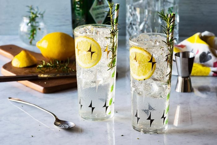 Glass of water with lemon and rosemary