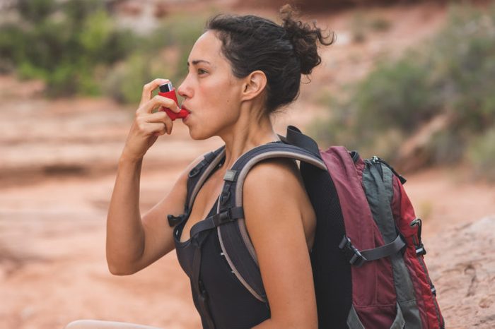 asthma inhaler woman hiking
