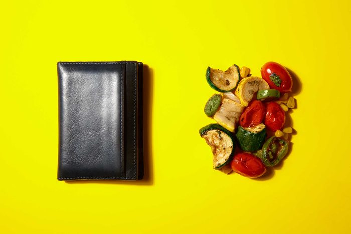 Illustration of portion control trick: wallet and fried veggies