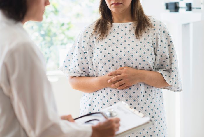 cropped shot of woman talking to doctor