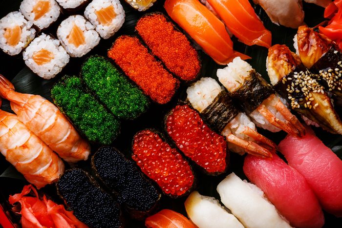 Rows of sushi and sashimi.