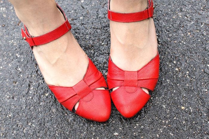 woman's feet in red sandals