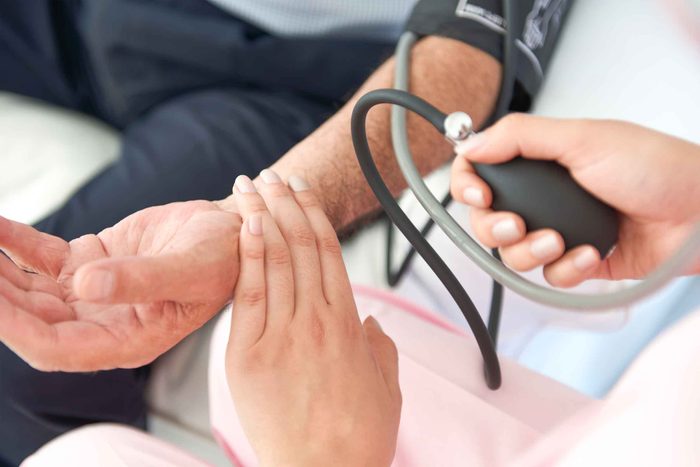 nurse checking a man's blood pressure