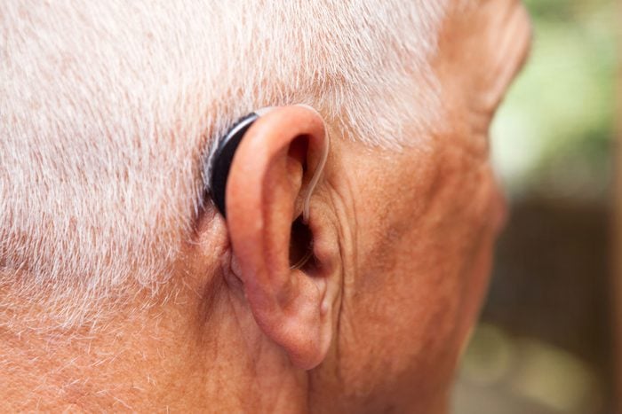 older man wearing a hearing aid