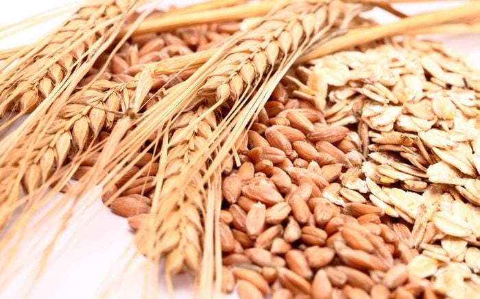 dried stalks of wheat with wheat kernels