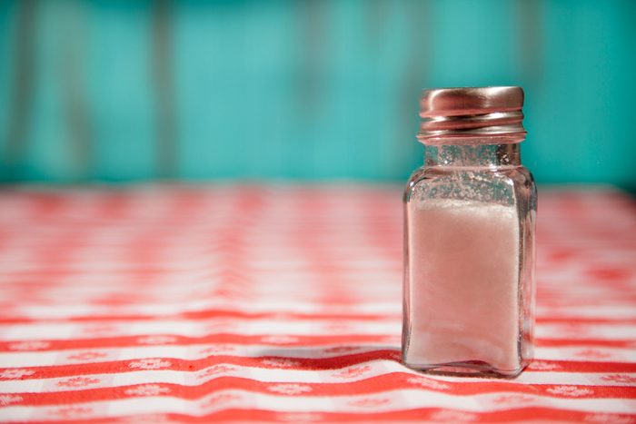 salt shake on gingham tablecloth