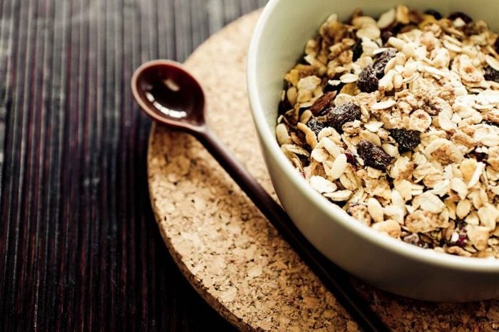 bowl of muesli with wooden spoon