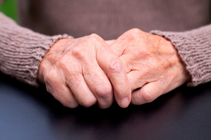 closeup of clasped elderly hands