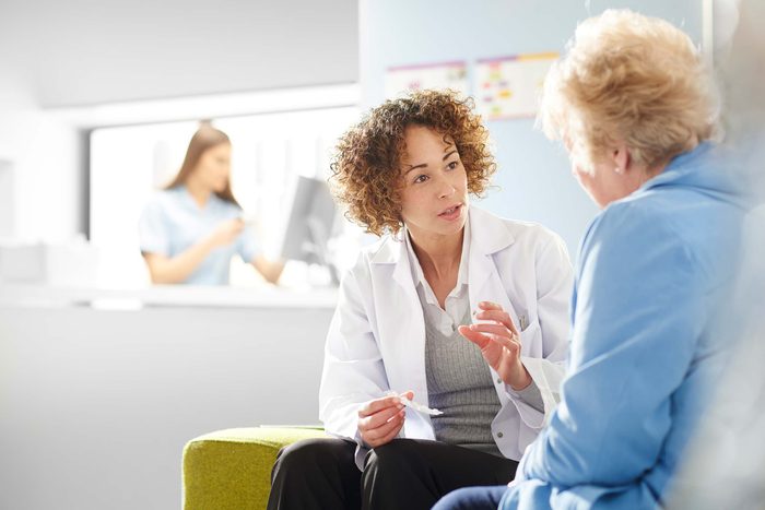 Older woman being counseled by a female health professional.