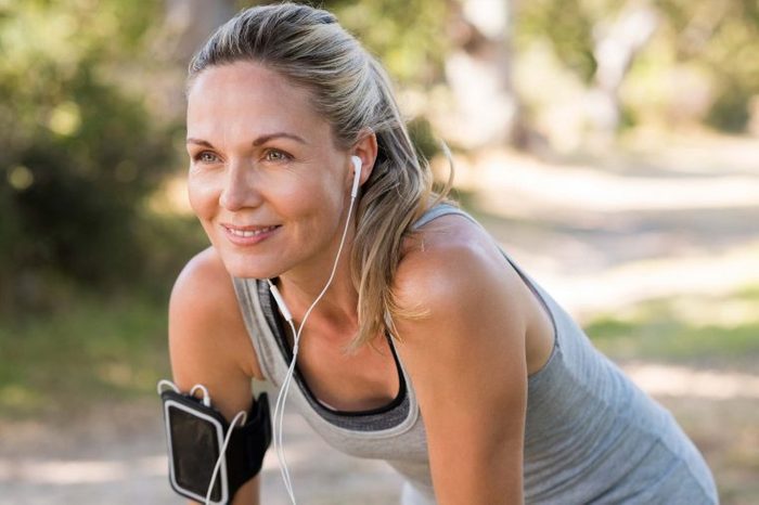 woman listening to music during an outdoor workout