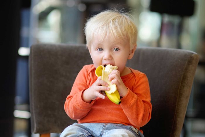toddler eating a banana