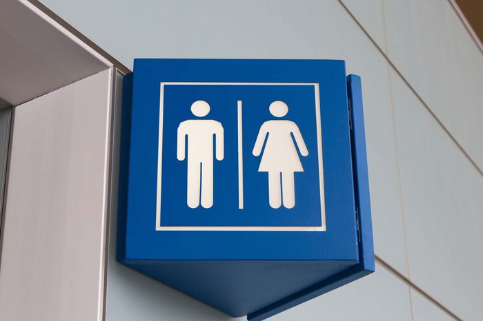 Restroom sign with male and female symbols.