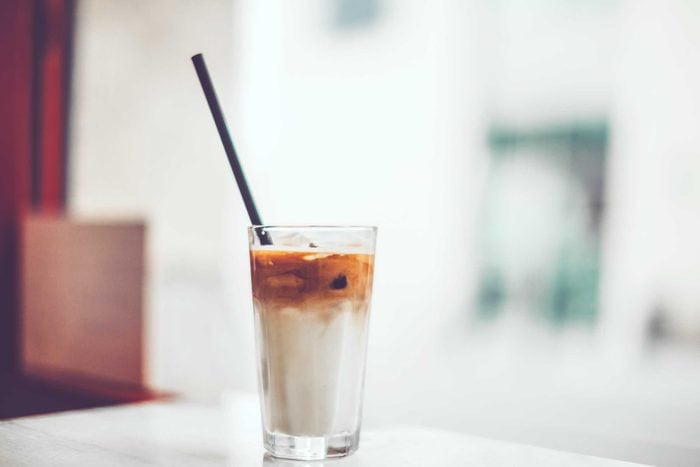 glass of iced coffee with milk with straw