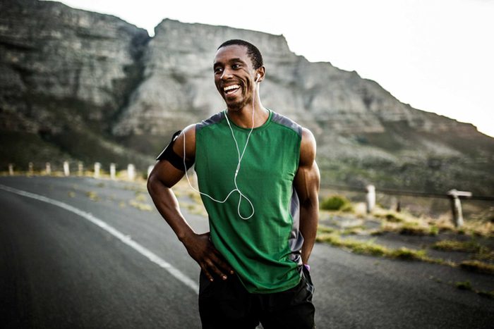 Man smiling during a run