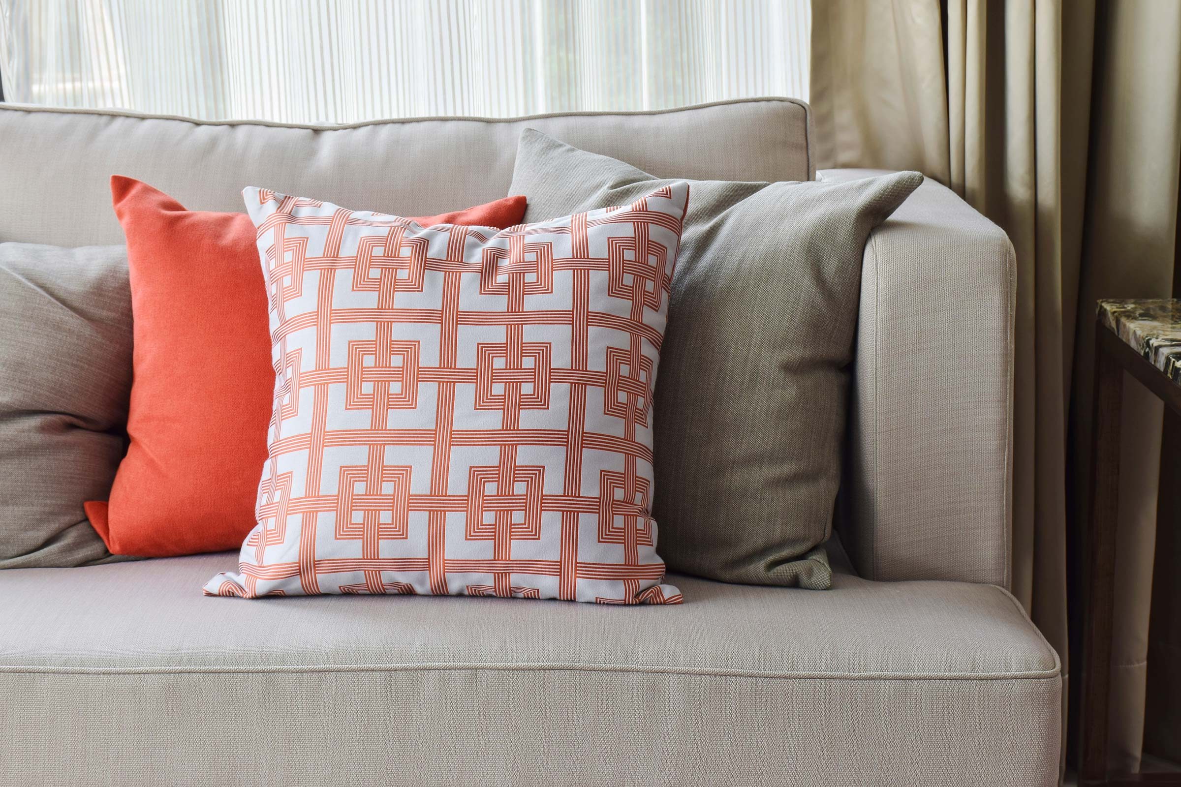 Gray couch with colorful pillows