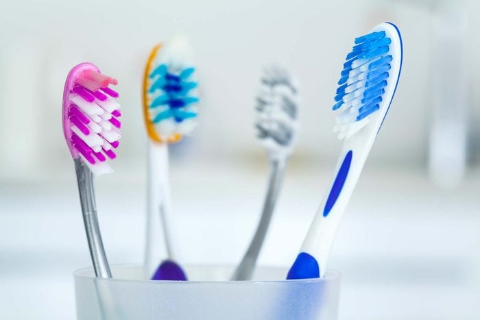 A cup of toothbrushes.