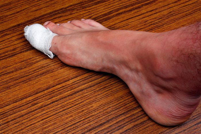 foot with a bandage on the big toe