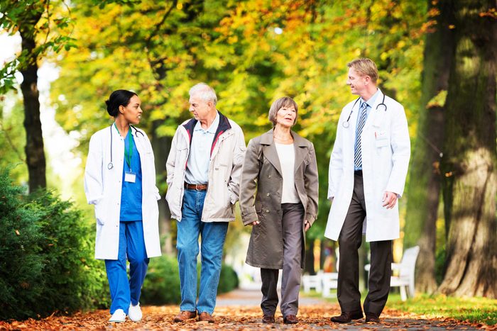 doctors and patients walking outdoors