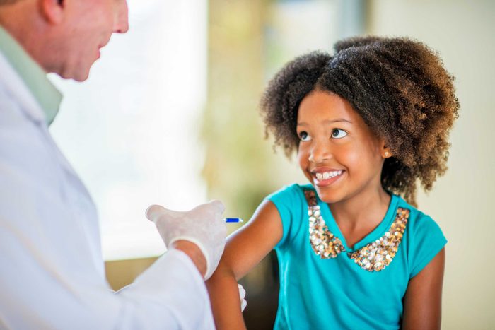 Girl getting vaccine