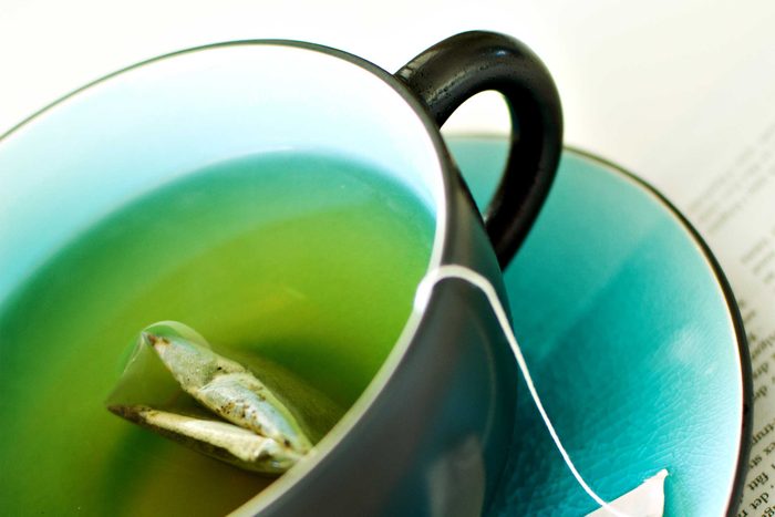 mug of green tea with tea bag