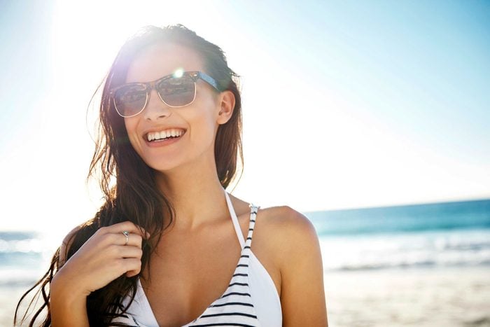 woman wearing sunglasses at beach